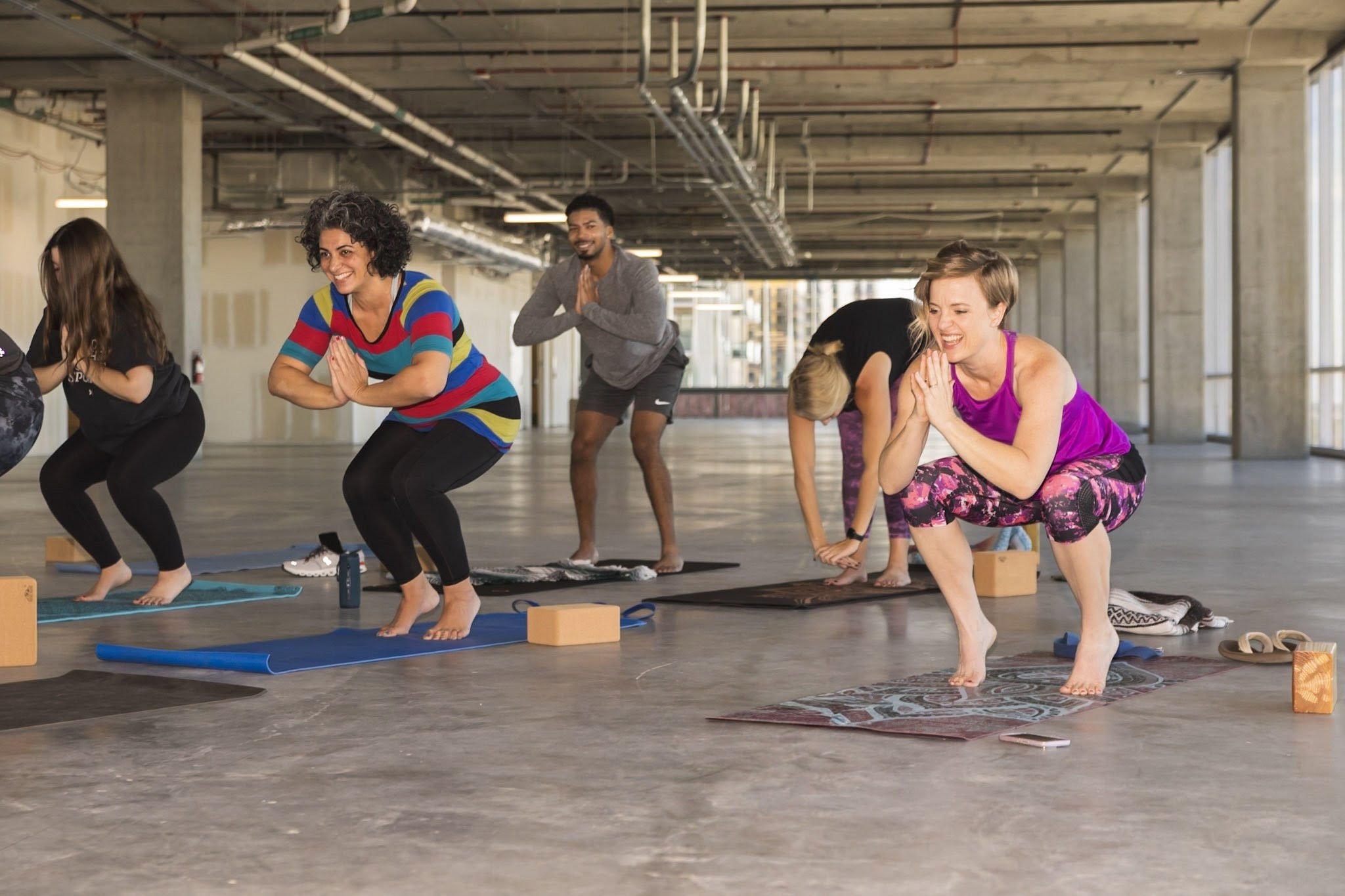 Coworkers moving together during a Sirrine Yoga wellness program